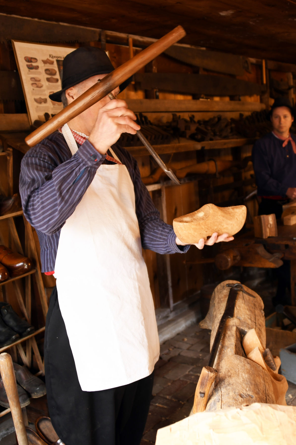 171 The Pella shoemaker demonstrates the process of making wooden shoes.JPG